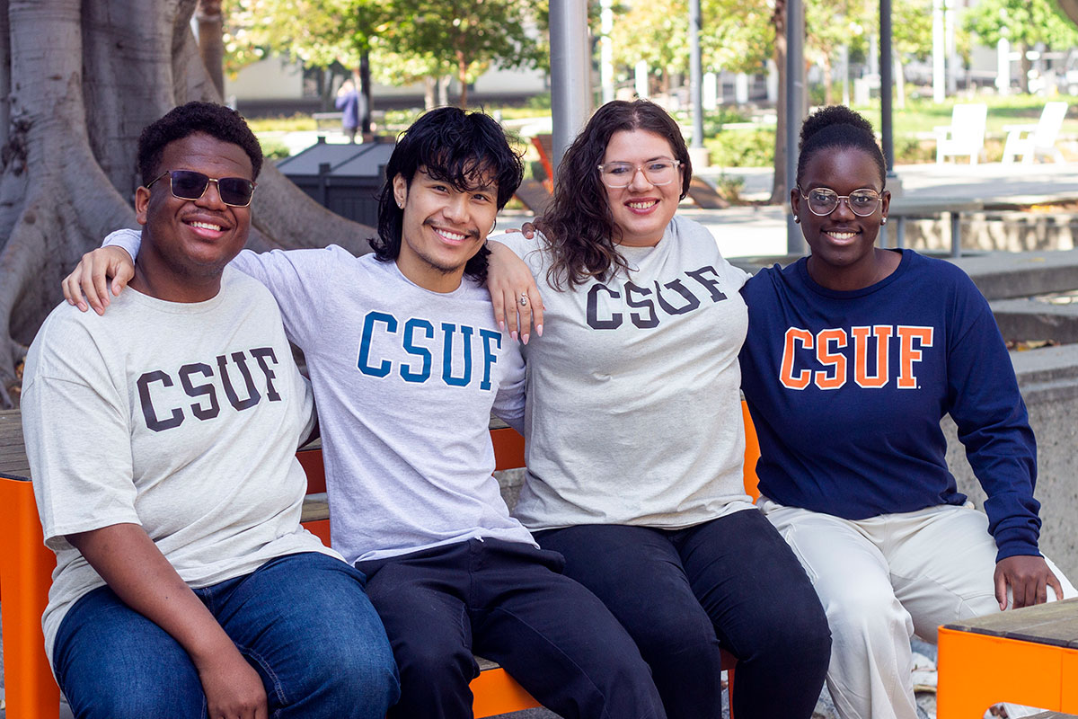 Students wearing block tees on campus